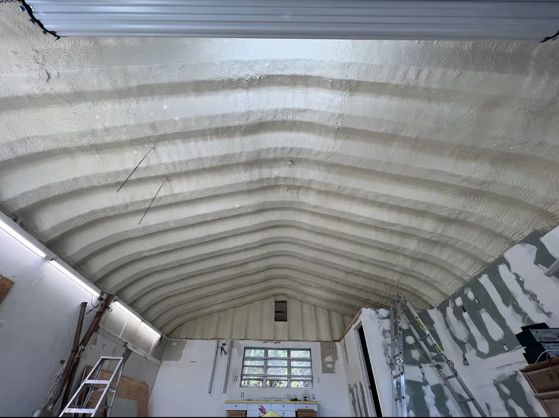 Spray polyurethane foam applied to the underside of a metal roof deck in Haltom City